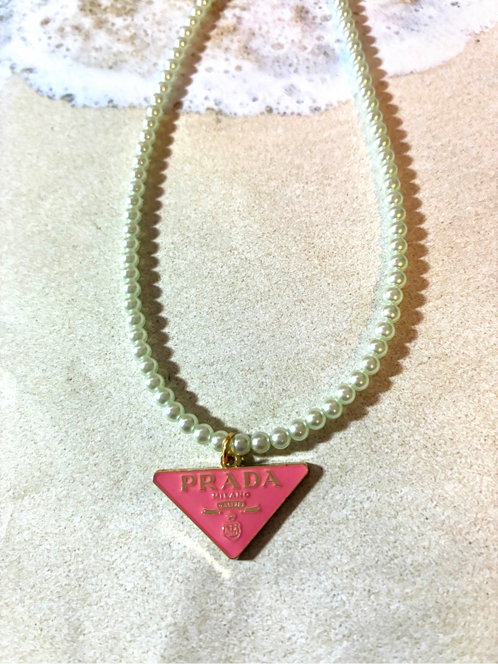 The unbranded Pink Triangle Pendant Pearl Necklace